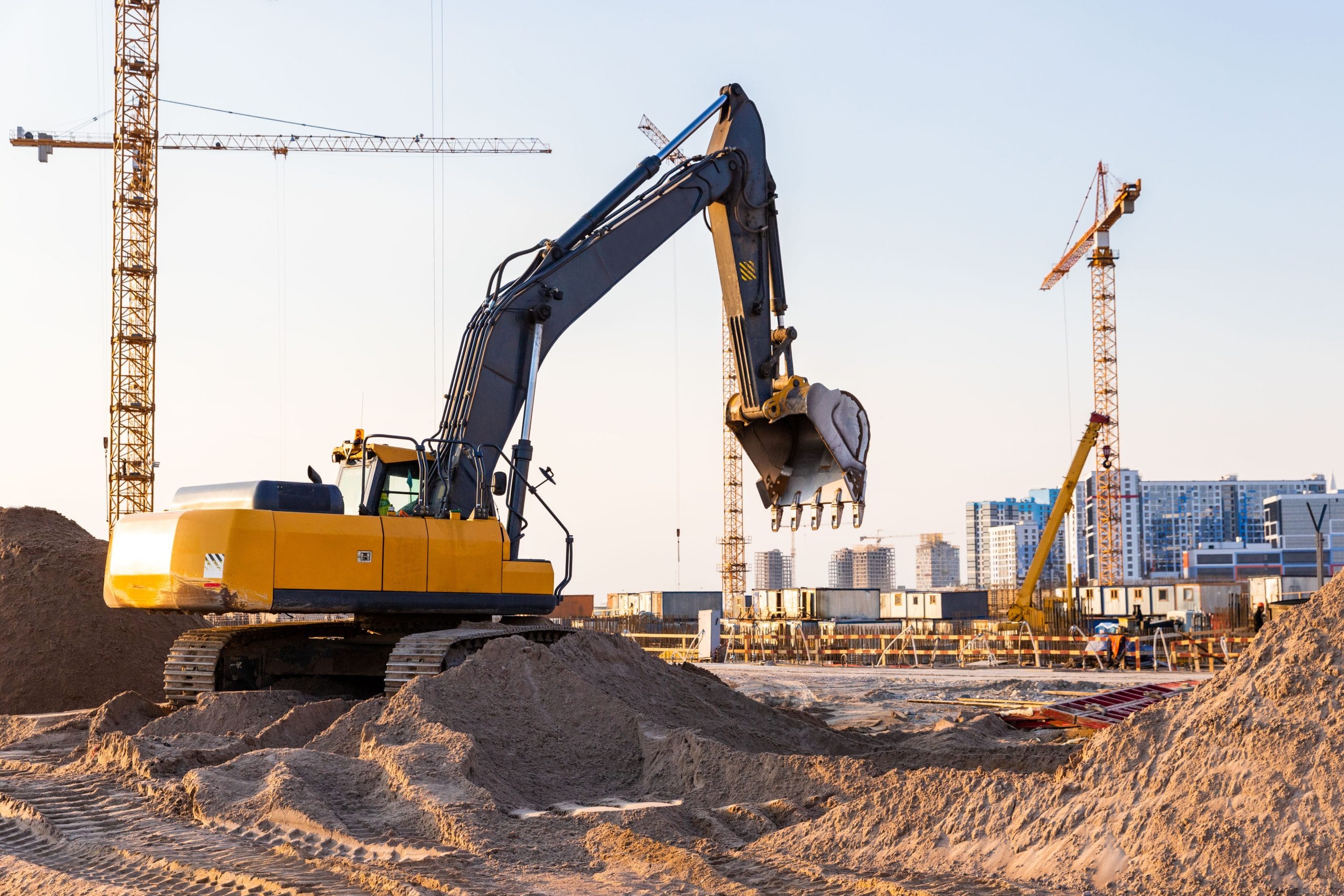 Tracked 360° excavator on construction site ready to excavate ground.